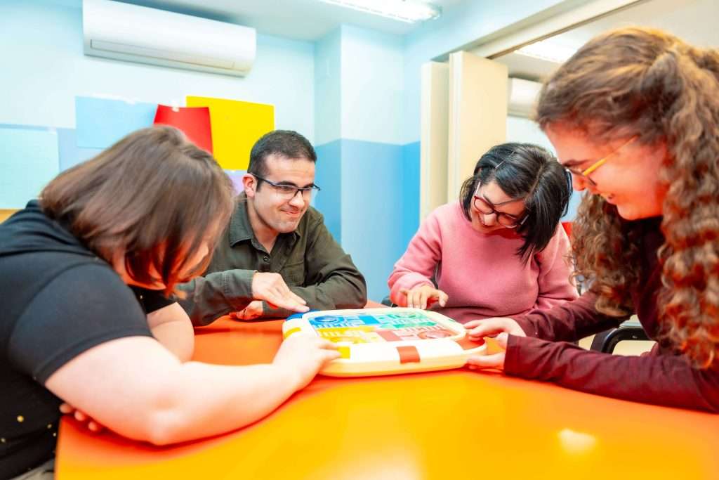 group-of-disabled-people-playing-board-games-toget-2024-03-06-04-48-47-utc-min